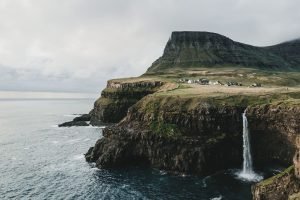 Four astonishing places Gasadalur, Faroe Islands by Photo by Hollie Harmsworth on Unsplash